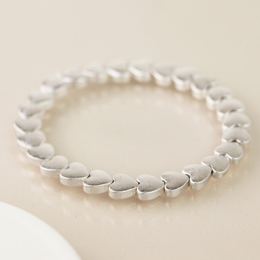 Pom Worn Silver Smooth Hearts Beaded Stretch Bracelet