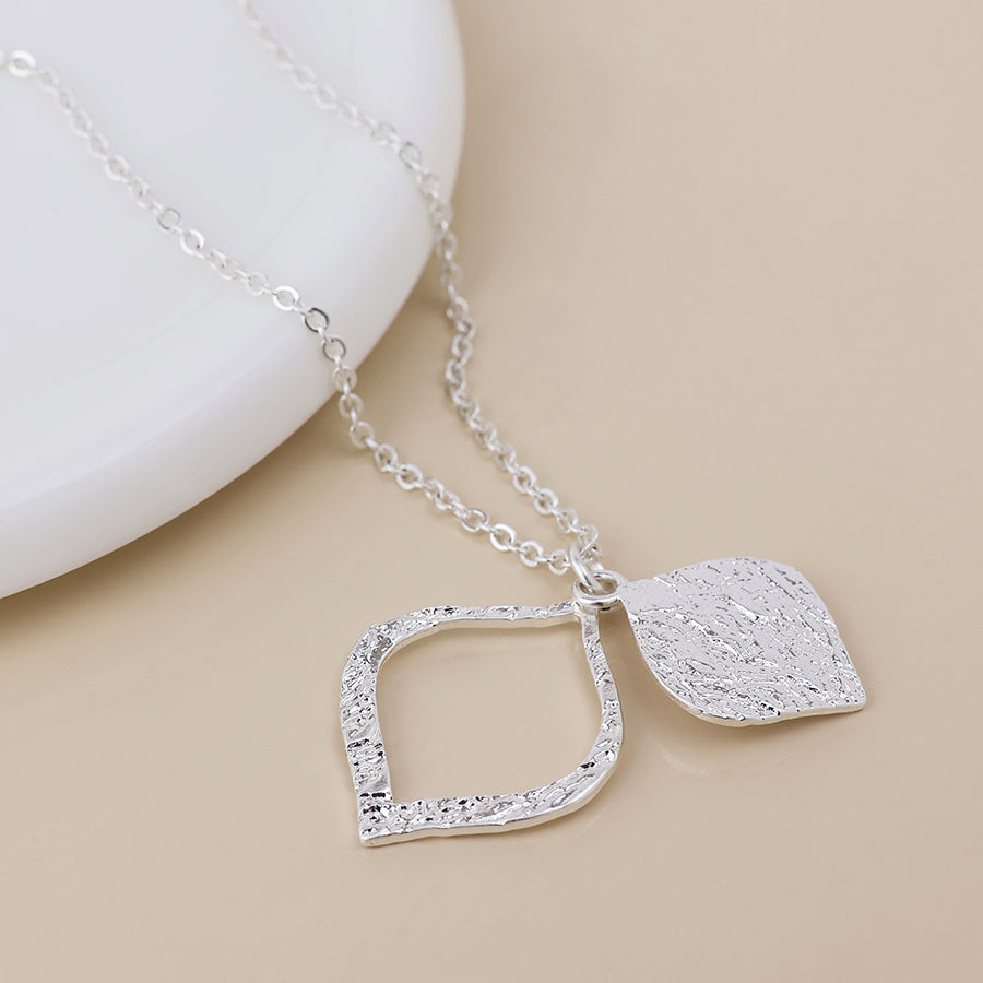 POM Halo silver plated foil textured layered leaf necklace