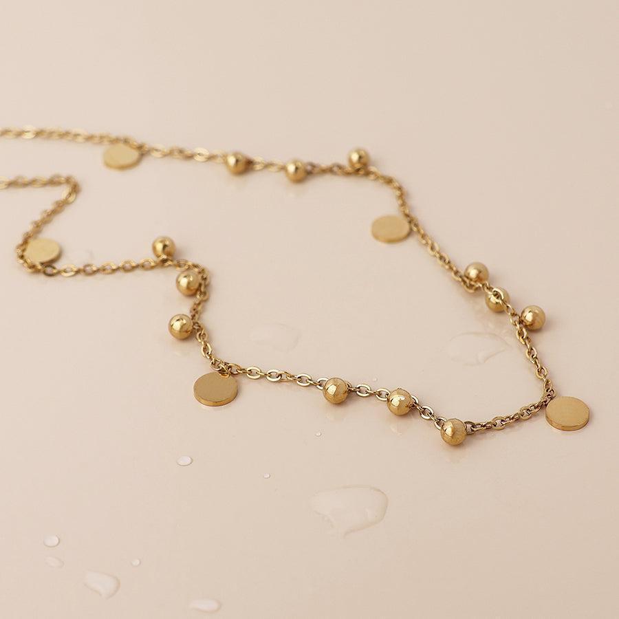 POM Waterproof gold plated bead and disc charm necklace