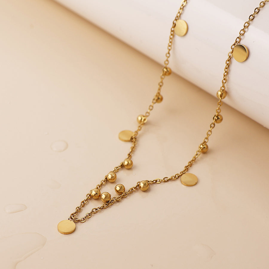 POM Waterproof gold plated bead and disc charm necklace