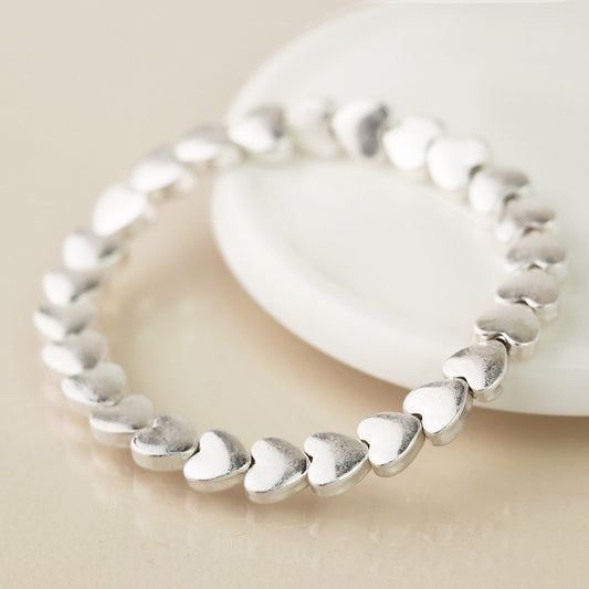 Pom Worn Silver Smooth Hearts Beaded Stretch Bracelet