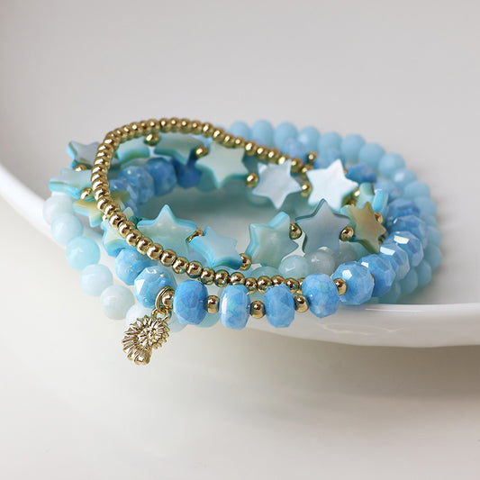 POM Blue and Gold Bead Bracelet Stack with Gold Shell Charm