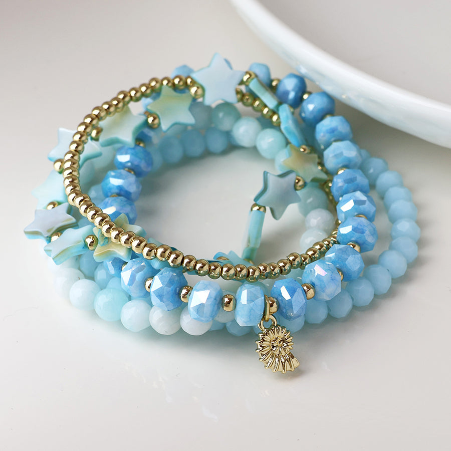 POM Blue and Gold Bead Bracelet Stack with Gold Shell Charm