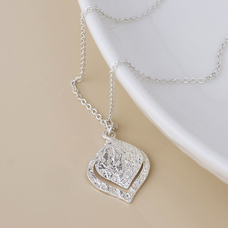 POM Halo silver plated foil textured layered leaf necklace