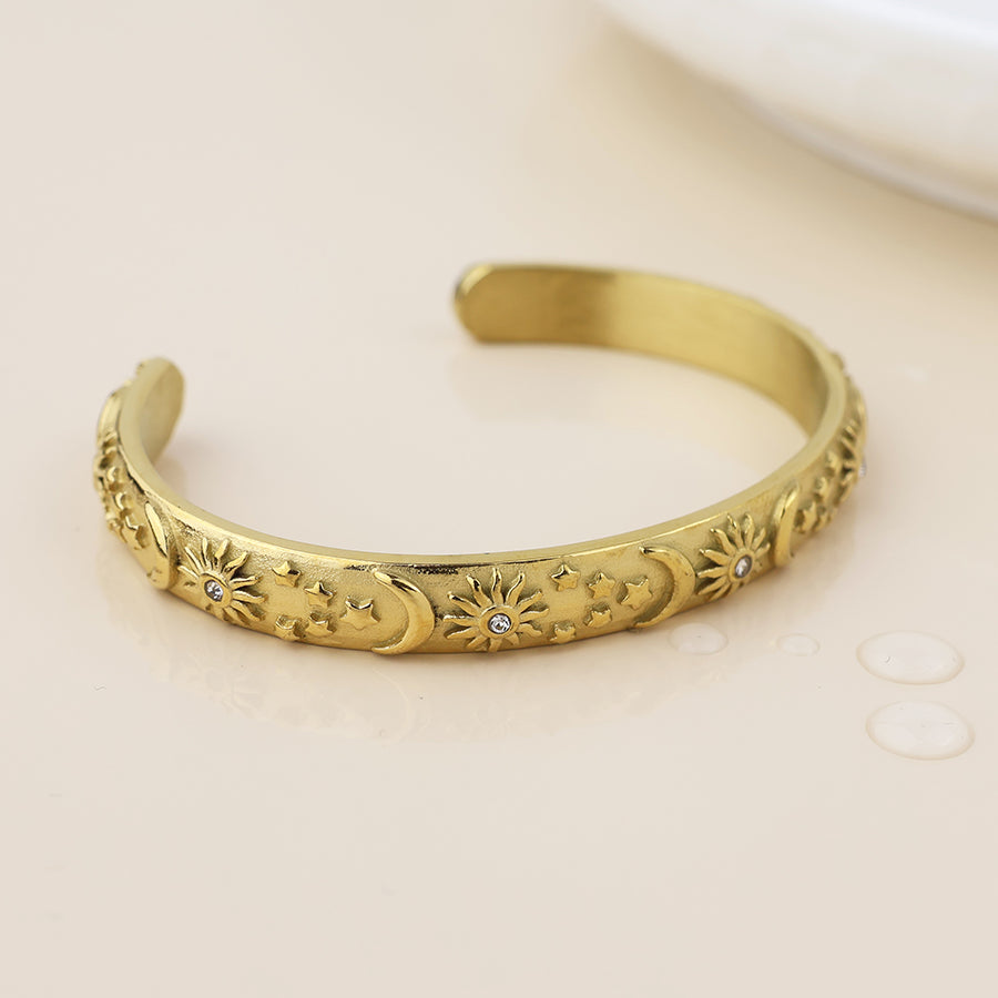 POM Waterproof gold plated moon, star and sun open bangle