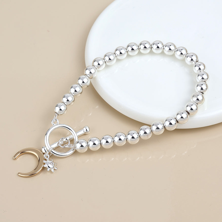 POM Silver plated bead, little sun and gold moon charm bracelet
