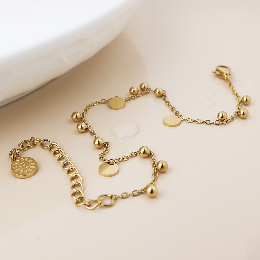 POM Waterproof gold plated bead and disc charm bracelet