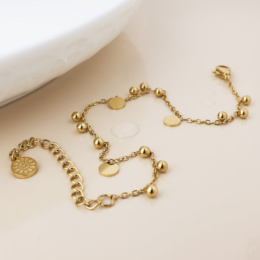 POM Waterproof gold plated bead and disc charm bracelet