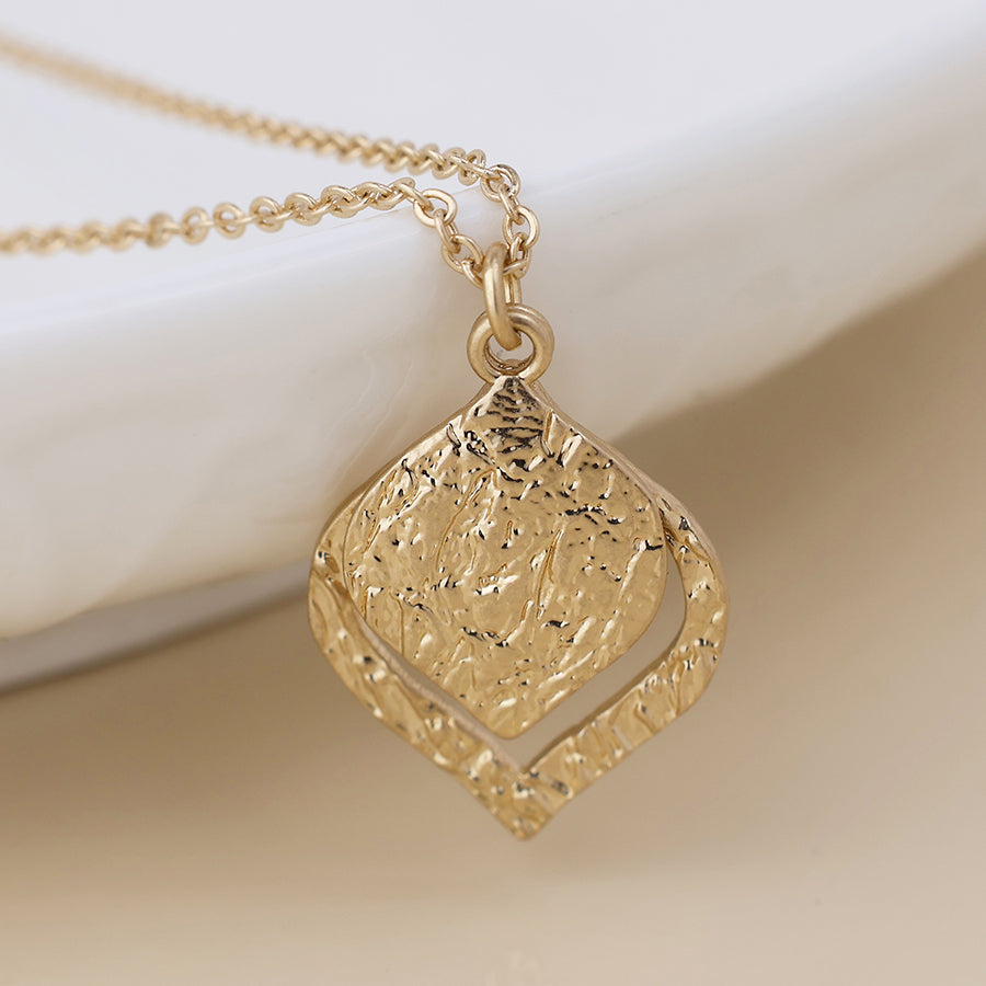 POM Halo golden foil textured layered leaf necklace