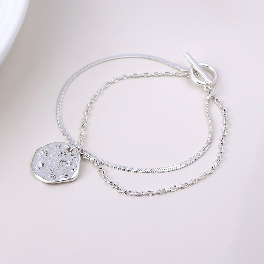 POM Solstice worn silver plated textured disc layered chain bracelet