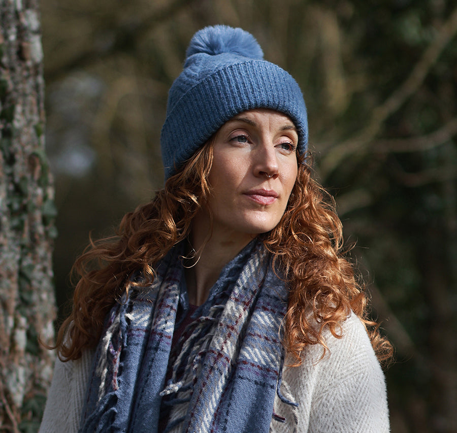 POM Charlotte Herringbone Knit Recycled Blend Bobble Hat in Dusky Blue