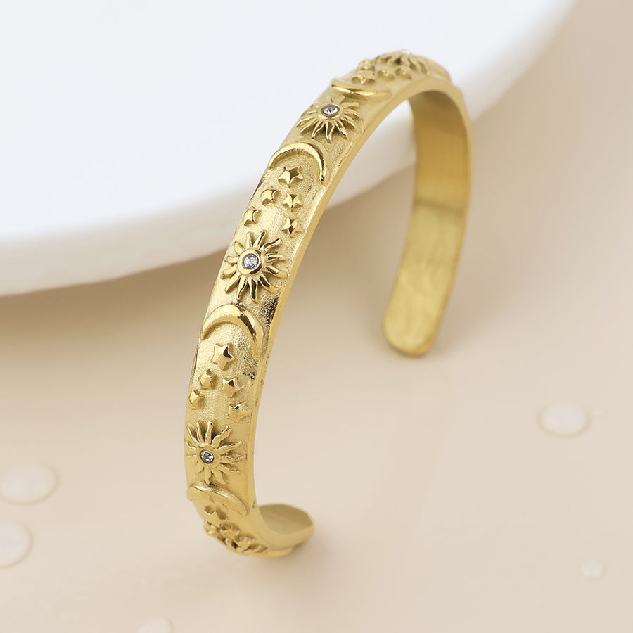 POM Waterproof gold plated moon, star and sun open bangle