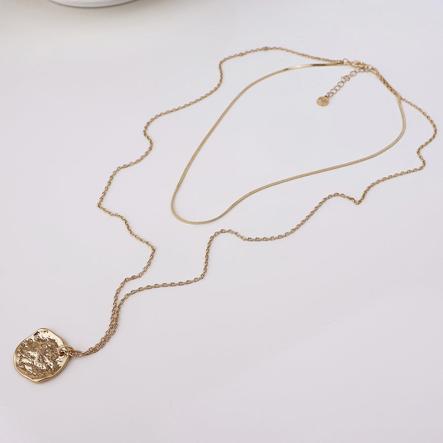 POM Solstice worn golden textured disc layered chain necklace