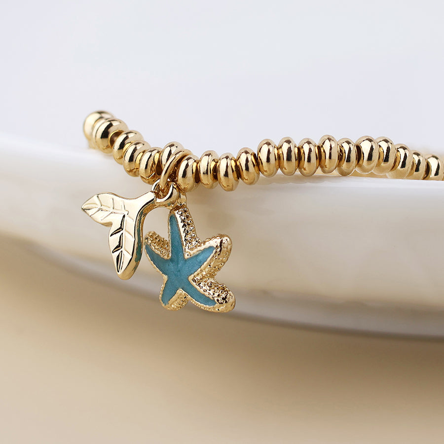 POM Golden whale tail and blue starfish charm bracelet