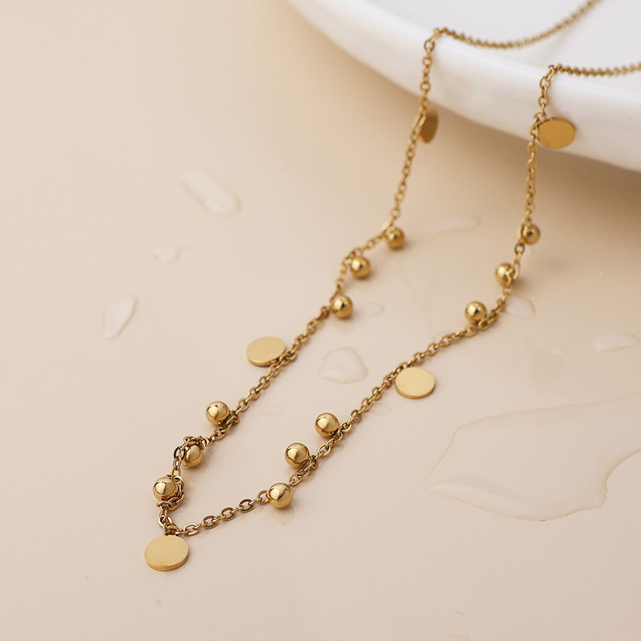 POM Waterproof gold plated bead and disc charm necklace