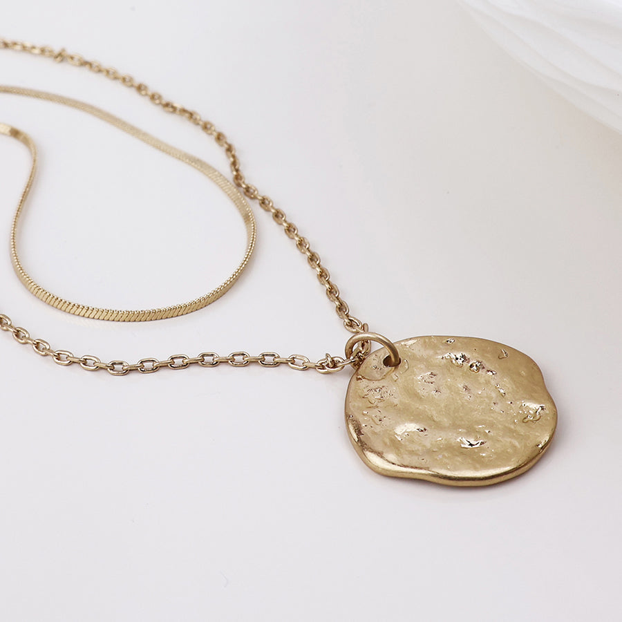 POM Solstice worn golden textured disc layered chain necklace