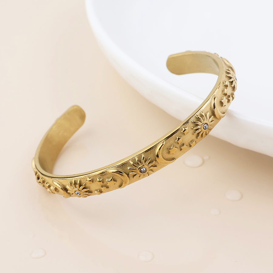 POM Waterproof gold plated moon, star and sun open bangle