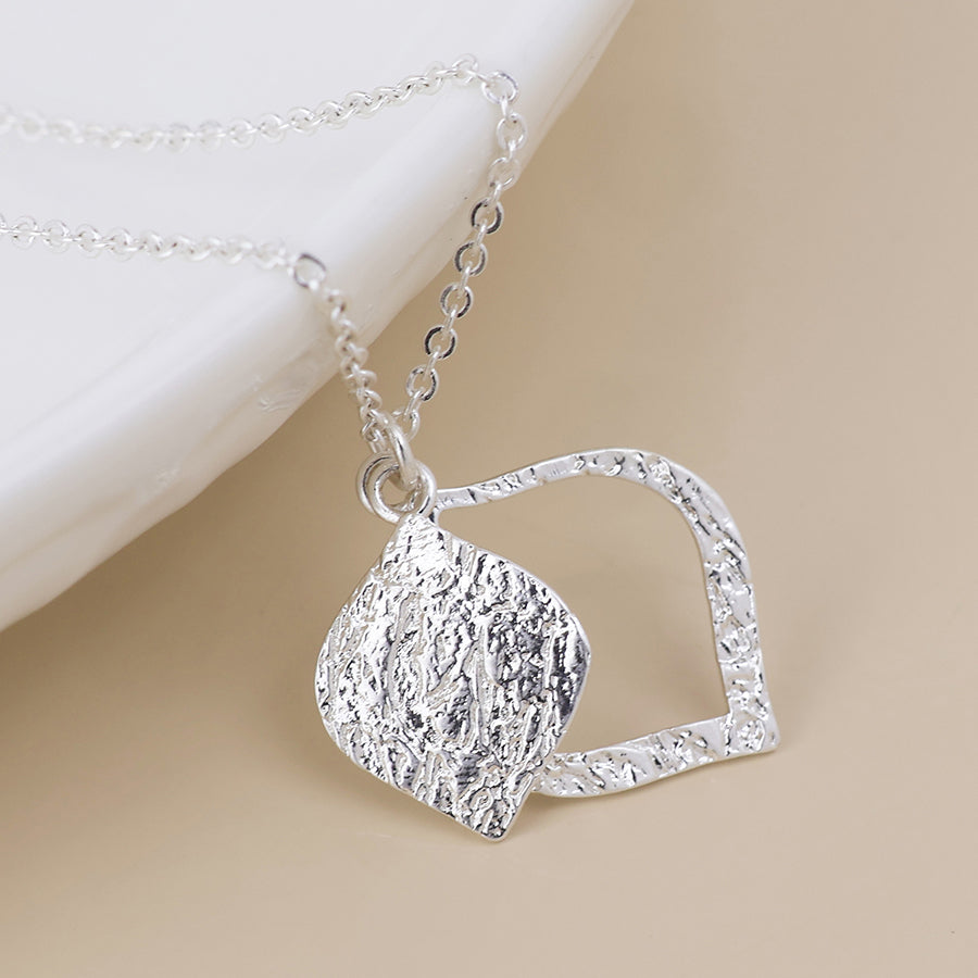 POM Halo silver plated foil textured layered leaf necklace