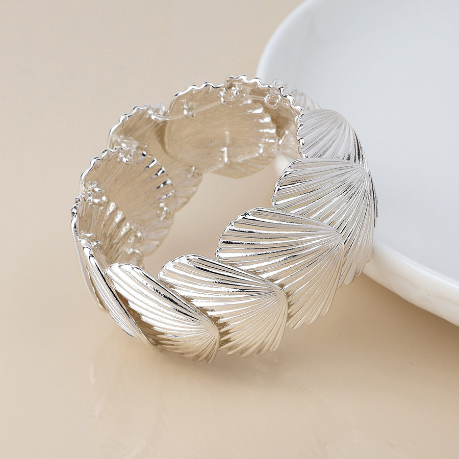POM Silver plated stretch clam shell bracelet