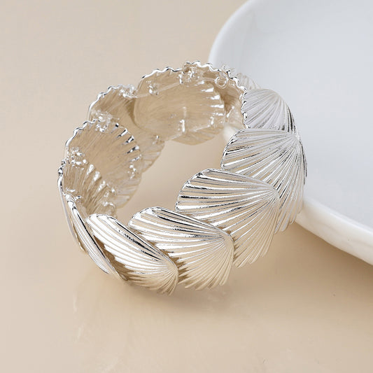 POM Silver plated stretch clam shell bracelet