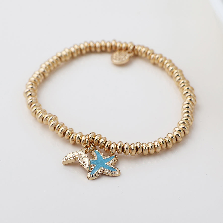 POM Golden whale tail and blue starfish charm bracelet