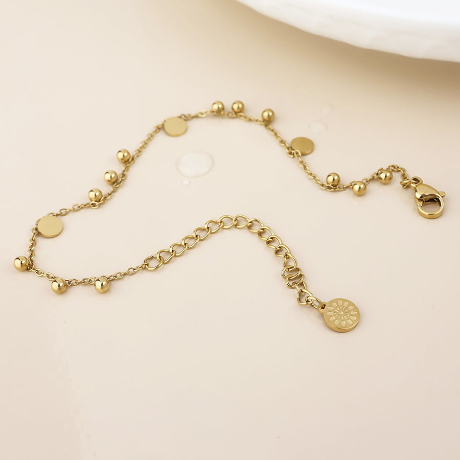 POM Waterproof gold plated bead and disc charm bracelet
