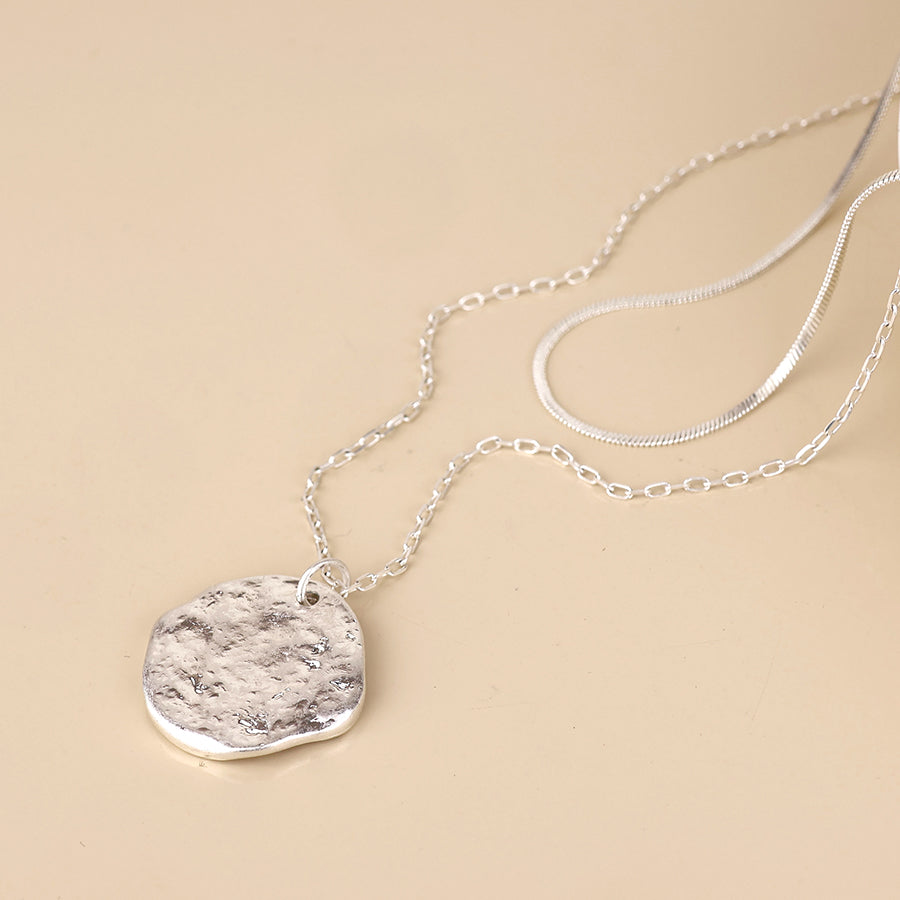 POM Solstice worn silver plated textured disc layered chain necklace